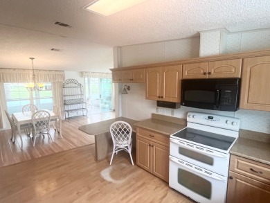 **Beautiful Home on the 17th green in Pine Lakes Country Club** on Pine Lakes Country Club in Florida - for sale on GolfHomes.com, golf home, golf lot