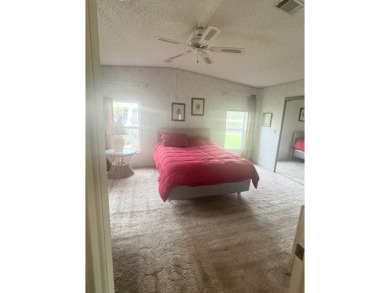 **Beautiful Home on the 17th green in Pine Lakes Country Club** on Pine Lakes Country Club in Florida - for sale on GolfHomes.com, golf home, golf lot