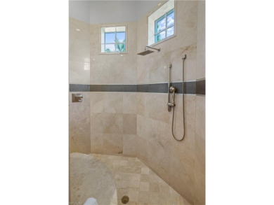 Sun-Soaked Sophistication on the Shores of Miromar Lakes! Tucked on Miromar Lakes Golf Club in Florida - for sale on GolfHomes.com, golf home, golf lot