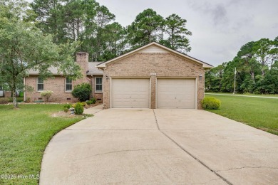 Welcome to 1513 Caracara Drive - Comfort, Style & Security in on Harbour Point Golf Club in North Carolina - for sale on GolfHomes.com, golf home, golf lot