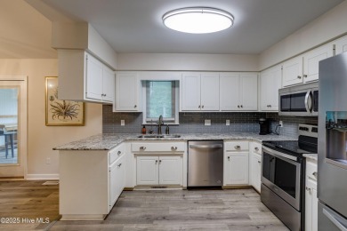 Welcome to 1513 Caracara Drive - Comfort, Style & Security in on Harbour Point Golf Club in North Carolina - for sale on GolfHomes.com, golf home, golf lot