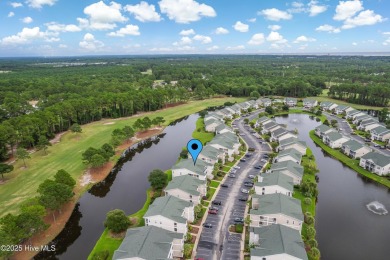 Don't Miss This First Floor - Golf  Pond View Condo in Sandpiper on Sandpiper Bay Golf and Country Club in North Carolina - for sale on GolfHomes.com, golf home, golf lot