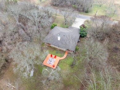 Welcome to this charming 3-bedroom, 2-bathroom home located in on White Bluff Resort - New Course in Texas - for sale on GolfHomes.com, golf home, golf lot