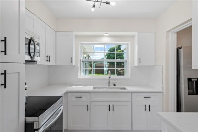Offered for sale is this incredible, renovated, 2-bedroom on Pasadena Yacht and Country Club in Florida - for sale on GolfHomes.com, golf home, golf lot