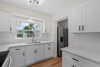Offered for sale is this incredible, renovated, 2-bedroom on Pasadena Yacht and Country Club in Florida - for sale on GolfHomes.com, golf home, golf lot