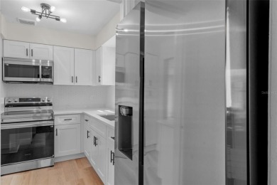 Offered for sale is this incredible, renovated, 2-bedroom on Pasadena Yacht and Country Club in Florida - for sale on GolfHomes.com, golf home, golf lot