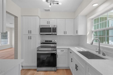 Offered for sale is this incredible, renovated, 2-bedroom on Pasadena Yacht and Country Club in Florida - for sale on GolfHomes.com, golf home, golf lot
