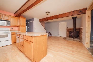 Discover the perfect retreat in this cozy chalet, ideally on Burning Oak Country Club in Michigan - for sale on GolfHomes.com, golf home, golf lot