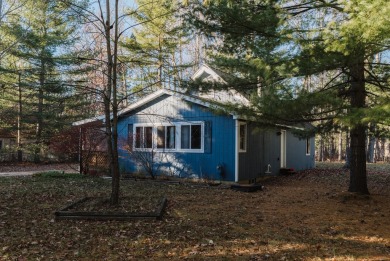 Discover the perfect retreat in this cozy chalet, ideally on Burning Oak Country Club in Michigan - for sale on GolfHomes.com, golf home, golf lot