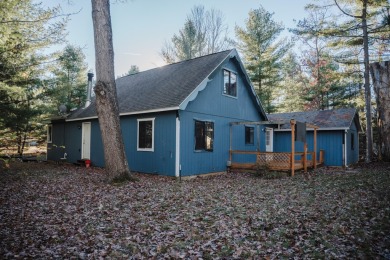 Discover the perfect retreat in this cozy chalet, ideally on Burning Oak Country Club in Michigan - for sale on GolfHomes.com, golf home, golf lot