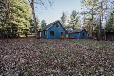 Discover the perfect retreat in this cozy chalet, ideally on Burning Oak Country Club in Michigan - for sale on GolfHomes.com, golf home, golf lot