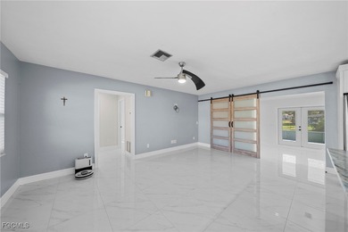 Completely remodeled and move-in ready, this beautiful river on Riverbend Golf and Country Club in Florida - for sale on GolfHomes.com, golf home, golf lot