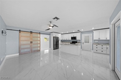 Completely remodeled and move-in ready, this beautiful river on Riverbend Golf and Country Club in Florida - for sale on GolfHomes.com, golf home, golf lot