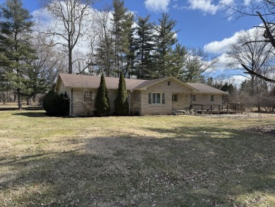 A MUST-SEE all stone ranch located in established Carmel on Woodland Country Club in Indiana - for sale on GolfHomes.com, golf home, golf lot