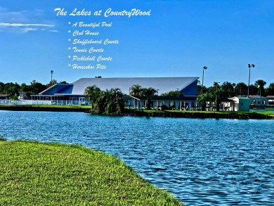 Discover a lovely home in Florida with breathtaking water views! on Golden Lakes Golf Course in Florida - for sale on GolfHomes.com, golf home, golf lot