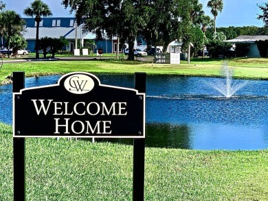 Discover a lovely home in Florida with breathtaking water views! on Golden Lakes Golf Course in Florida - for sale on GolfHomes.com, golf home, golf lot