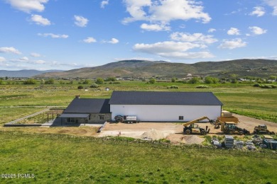 Nestled on a sprawling 5.86-acre lot surrounded by the serene on Victory Ranch Golf Club in Utah - for sale on GolfHomes.com, golf home, golf lot
