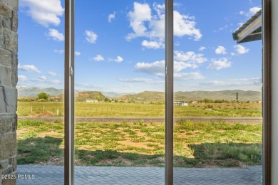 Nestled on a sprawling 5.86-acre lot surrounded by the serene on Victory Ranch Golf Club in Utah - for sale on GolfHomes.com, golf home, golf lot