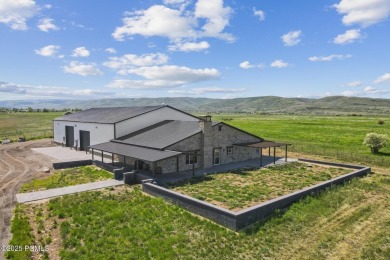 Nestled on a sprawling 5.86-acre lot surrounded by the serene on Victory Ranch Golf Club in Utah - for sale on GolfHomes.com, golf home, golf lot