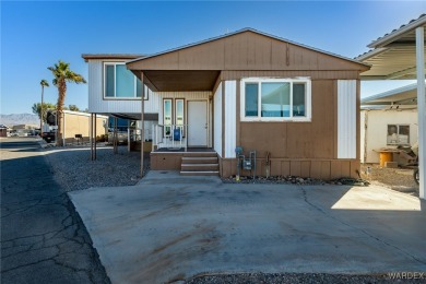 Welcome to your serene retreat in the highly sought-after on London Bridge Golf Course in Arizona - for sale on GolfHomes.com, golf home, golf lot