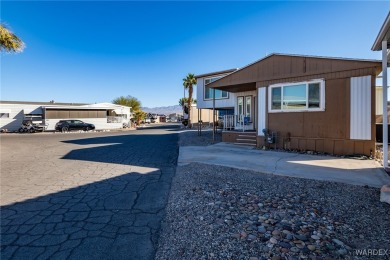 Welcome to your serene retreat in the highly sought-after on London Bridge Golf Course in Arizona - for sale on GolfHomes.com, golf home, golf lot