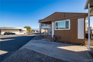 Welcome to your serene retreat in the highly sought-after on London Bridge Golf Course in Arizona - for sale on GolfHomes.com, golf home, golf lot