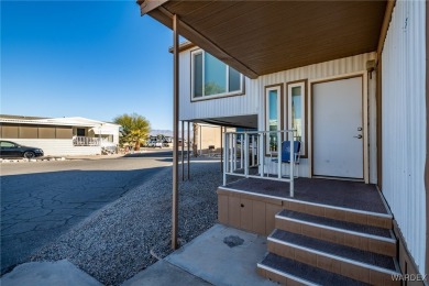 Welcome to your serene retreat in the highly sought-after on London Bridge Golf Course in Arizona - for sale on GolfHomes.com, golf home, golf lot