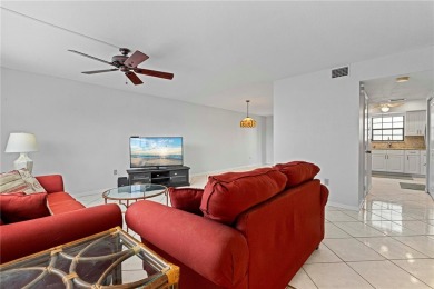 STUNNING WATERFRONT TOWNHOME IN PGI W/DEEDED DOCK - Discover the on Saint Andrews South Golf Club in Florida - for sale on GolfHomes.com, golf home, golf lot