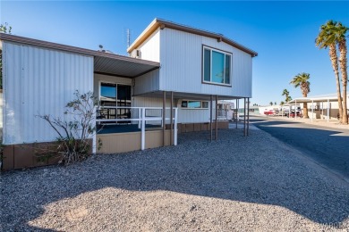 Welcome to your serene retreat in the highly sought-after on London Bridge Golf Course in Arizona - for sale on GolfHomes.com, golf home, golf lot