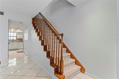 STUNNING WATERFRONT TOWNHOME IN PGI W/DEEDED DOCK - Discover the on Saint Andrews South Golf Club in Florida - for sale on GolfHomes.com, golf home, golf lot