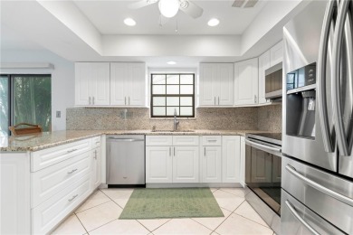 STUNNING WATERFRONT TOWNHOME IN PGI W/DEEDED DOCK - Discover the on Saint Andrews South Golf Club in Florida - for sale on GolfHomes.com, golf home, golf lot