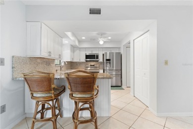 STUNNING WATERFRONT TOWNHOME IN PGI W/DEEDED DOCK - Discover the on Saint Andrews South Golf Club in Florida - for sale on GolfHomes.com, golf home, golf lot