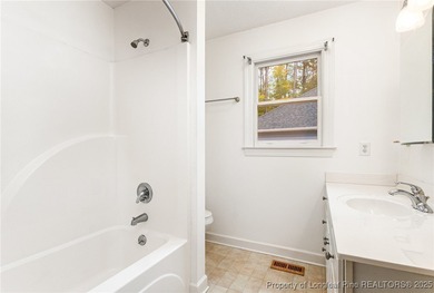 Welcome to this beautiful 3-bedroom, 2-bath home located in a on Carolina Trace Country Club in North Carolina - for sale on GolfHomes.com, golf home, golf lot