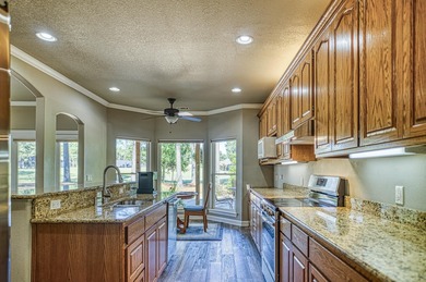 Imagine sitting on the huge shade filled, all stone, covered on Granada Golf Course in Arkansas - for sale on GolfHomes.com, golf home, golf lot