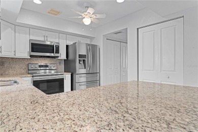 STUNNING WATERFRONT TOWNHOME IN PGI W/DEEDED DOCK - Discover the on Saint Andrews South Golf Club in Florida - for sale on GolfHomes.com, golf home, golf lot