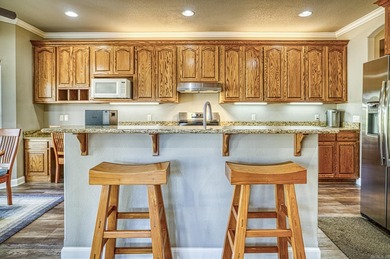 Imagine sitting on the huge shade filled, all stone, covered on Granada Golf Course in Arkansas - for sale on GolfHomes.com, golf home, golf lot