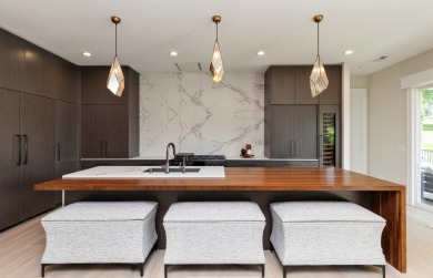 Majestic views. Unrivaled privacy. Walls of glass invite on Wakonda Club in Iowa - for sale on GolfHomes.com, golf home, golf lot
