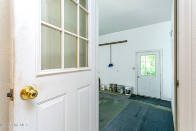 Custom built 3-bedroom, 2 bath rancher style home in the on Sound Golf Links at Albemarle Plantation in North Carolina - for sale on GolfHomes.com, golf home, golf lot