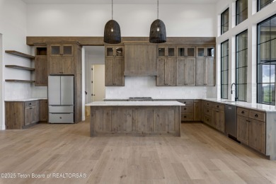 This custom home in Teton Reserve offers a unique plan with on Teton Reserve in Idaho - for sale on GolfHomes.com, golf home, golf lot