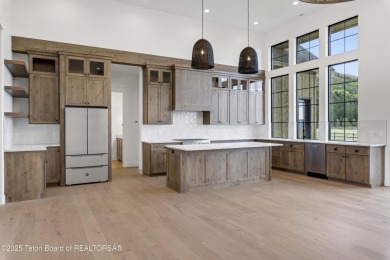This custom home in Teton Reserve offers a unique plan with on Teton Reserve in Idaho - for sale on GolfHomes.com, golf home, golf lot
