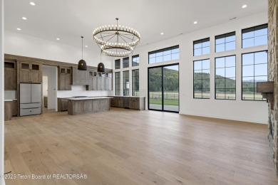 This custom home in Teton Reserve offers a unique plan with on Teton Reserve in Idaho - for sale on GolfHomes.com, golf home, golf lot