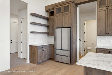 This custom home in Teton Reserve offers a unique plan with on Teton Reserve in Idaho - for sale on GolfHomes.com, golf home, golf lot