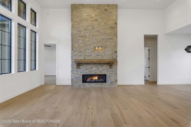 This custom home in Teton Reserve offers a unique plan with on Teton Reserve in Idaho - for sale on GolfHomes.com, golf home, golf lot