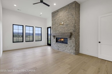 This custom home in Teton Reserve offers a unique plan with on Teton Reserve in Idaho - for sale on GolfHomes.com, golf home, golf lot