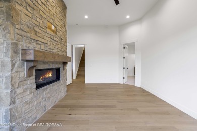 This custom home in Teton Reserve offers a unique plan with on Teton Reserve in Idaho - for sale on GolfHomes.com, golf home, golf lot