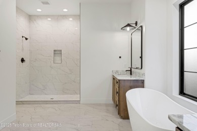 This custom home in Teton Reserve offers a unique plan with on Teton Reserve in Idaho - for sale on GolfHomes.com, golf home, golf lot