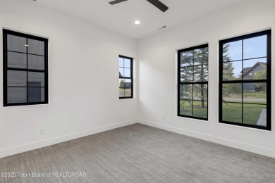 This custom home in Teton Reserve offers a unique plan with on Teton Reserve in Idaho - for sale on GolfHomes.com, golf home, golf lot