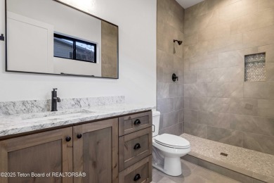 This custom home in Teton Reserve offers a unique plan with on Teton Reserve in Idaho - for sale on GolfHomes.com, golf home, golf lot