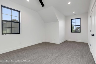 This custom home in Teton Reserve offers a unique plan with on Teton Reserve in Idaho - for sale on GolfHomes.com, golf home, golf lot