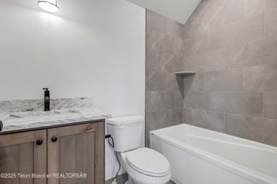 This custom home in Teton Reserve offers a unique plan with on Teton Reserve in Idaho - for sale on GolfHomes.com, golf home, golf lot